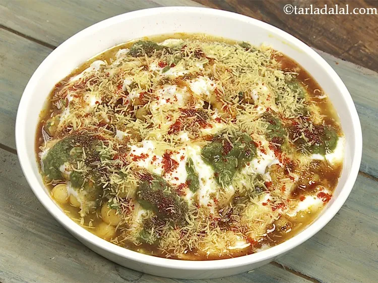 Step 34 – Finally sprinkle 1 tbsp of sev. For an added crunch, you can sprinkle broken papdis, …