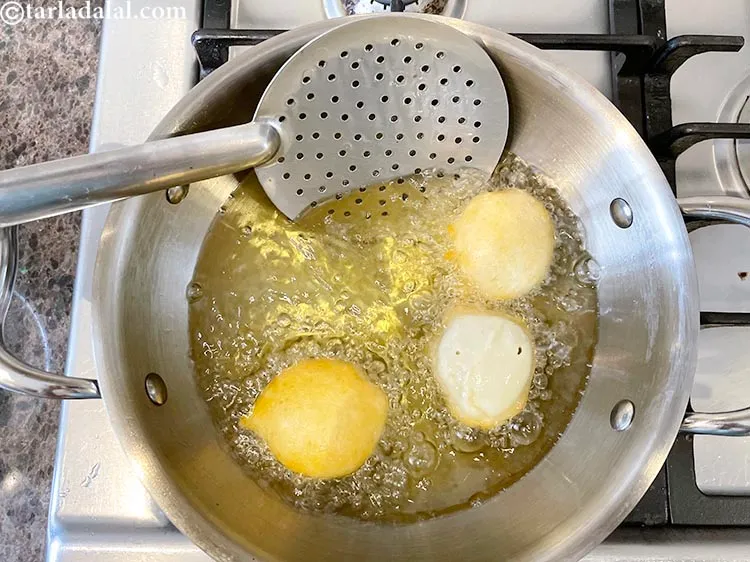 Step 21 – Flip over with a laddle and fry the other side.