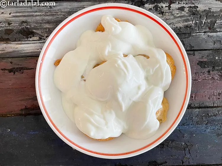 Step 33 – Top with the&nbsp;sweetened curd mixture. Pour half the curd mixture in each plate if you …