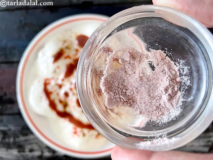 Step 37 – Sprinkle <a href="glossary-black-salt-sanchal-kala-namak-422i">black salt (sanchal)</a>.