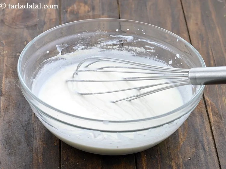स्टेप 34 – दही के मिश्रण को अच्छी तरह फेंट लें। इसमें कोई …