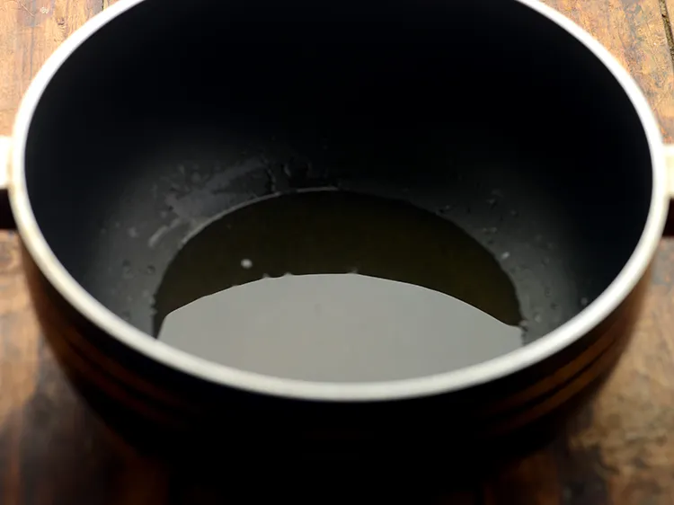 Step 8 – For the tempering of <strong>dahi wali aloo sabzi</strong>, heat the ghee in a deep non-stick …