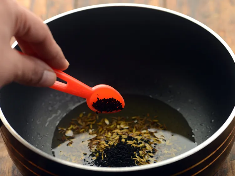 Step 12 – Add nigella seeds.