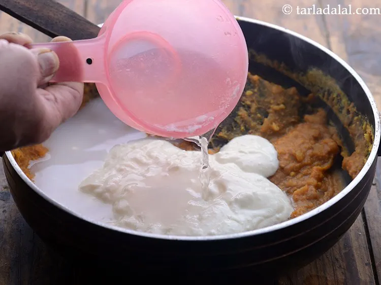 Step 24 – Add &frac12; cup of water. Add more or less water as per the consistency you …