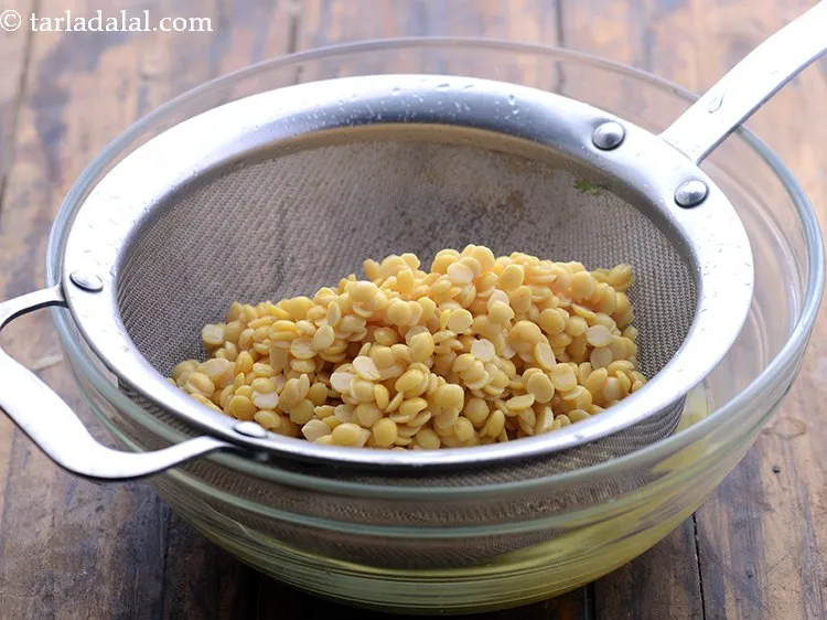 Step 4 – After 2 hours, drain the dal using a strainer.
