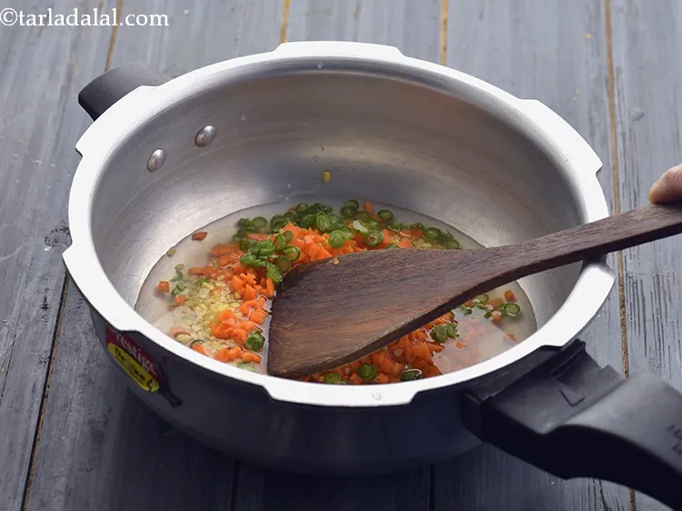 Step 25 – Mix well with the help of a ladle.&nbsp;