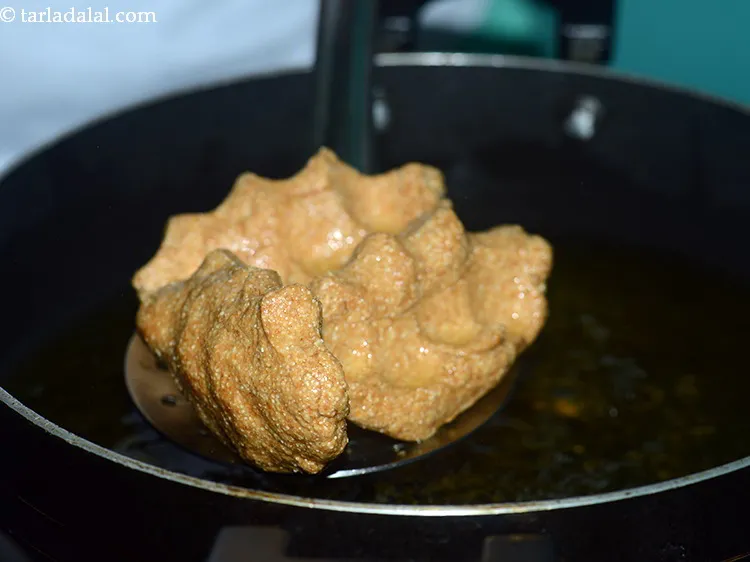 Step 23 – Fry them on a slow flame only so they cook from inside too.