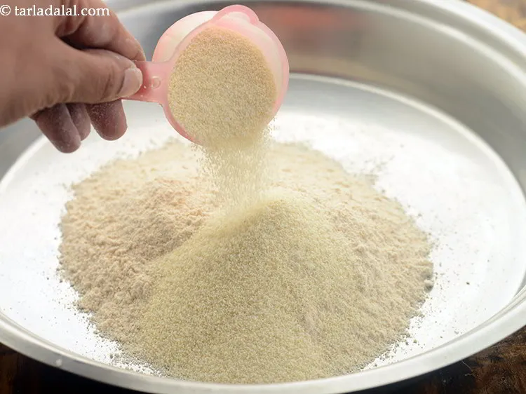 Step 3 – Add semolina to get the coarse texture in<strong> churma</strong>. If using Jada gehun then skip …