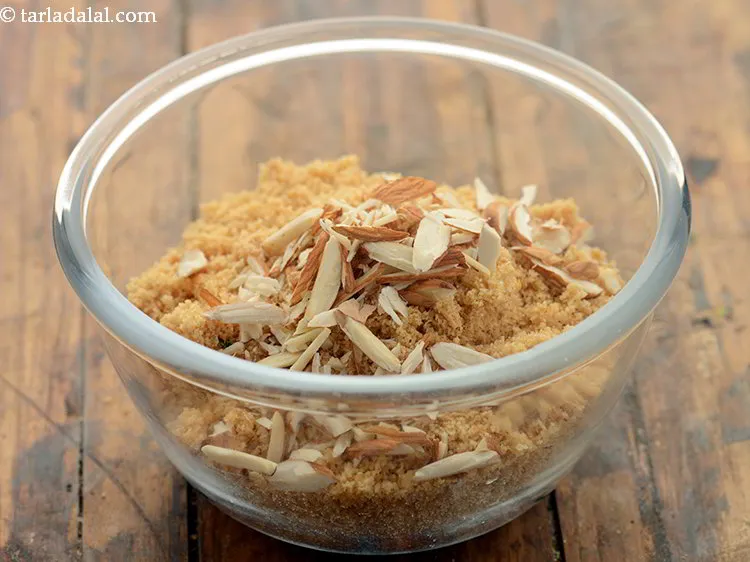 Step 18 – Add almonds. Other dried ingredients like walnuts, pistachios, raisins can also be added.