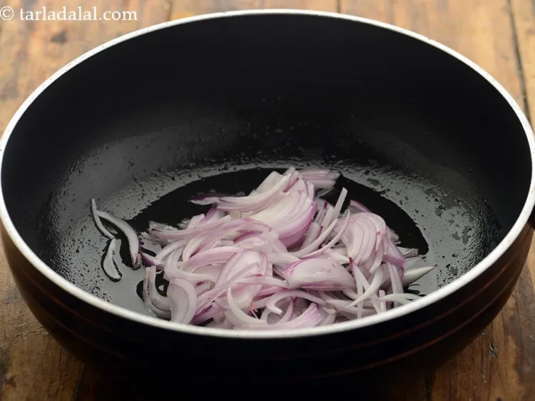 Step 9 – Once the ghee is hot, add the onions.