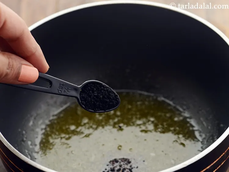 Step 14 – Add nigella seeds. We are not using cumin seeds but nigella to give a strong …