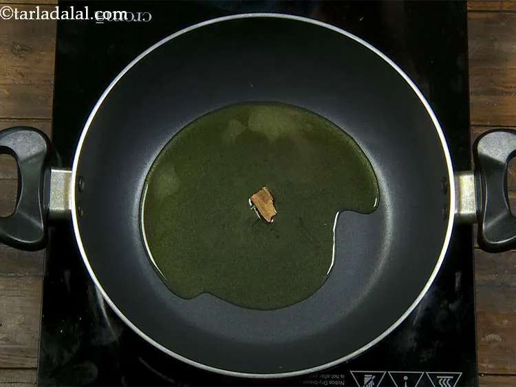 Step 8 – Once the ghee has melted completely, we add the whole spices. The first spice we …