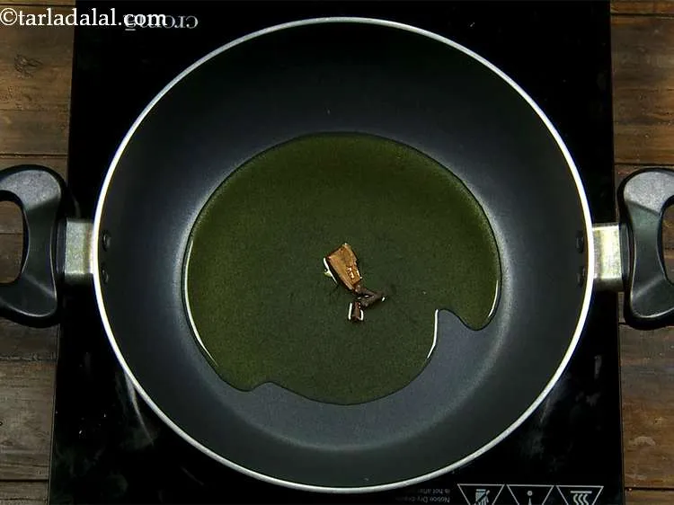 Step 9 – With dalchini, we also add cloves and saut? both these spices on a medium flame …