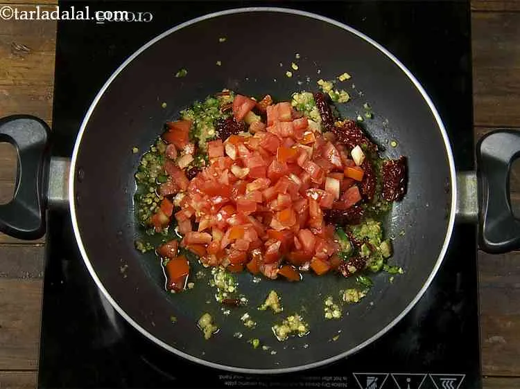 Step 13 – To give a juicy and slightly tangy flavor, we will add tomatoes.