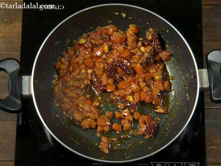 Step 15 – We also add turmeric powder, coriander powder and salt along with the other spices. While …