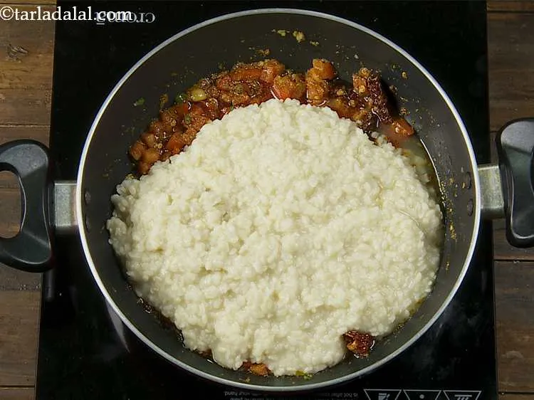 Step 16 – We are nearing the end of the recipe. Add the cooked urad dal to the …