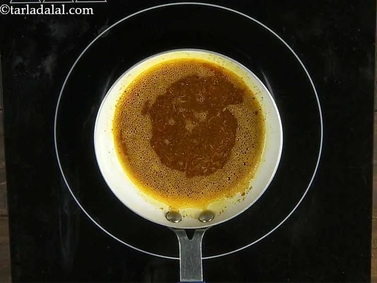 Step 21 – Once they crackle add the chilli powder and garam masala and saut? on a medium …