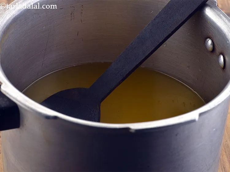 Step 11 – Finally add 5 cups of water to the pressure cooker and mix well.