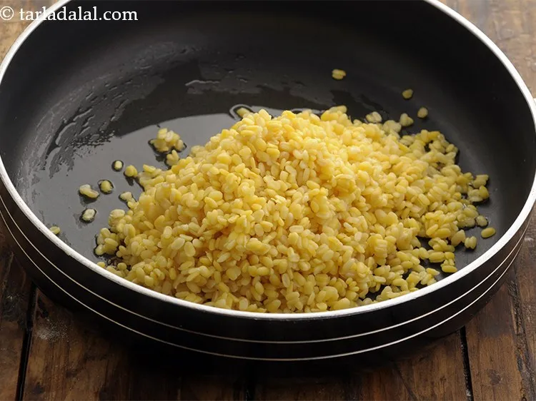 Step 13 – Add cooked yellow moong dal.&nbsp;