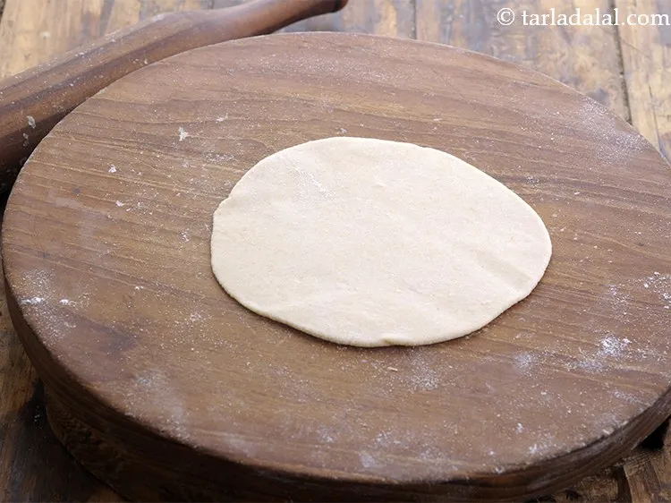 Step 21 – Roll out the dough into 4&quot; circle, use wheat flour to roll.&nbsp;