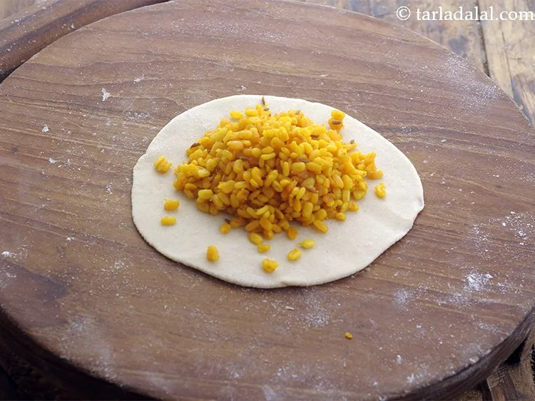 Step 22 – Place a portion of the stuffing in the centre.