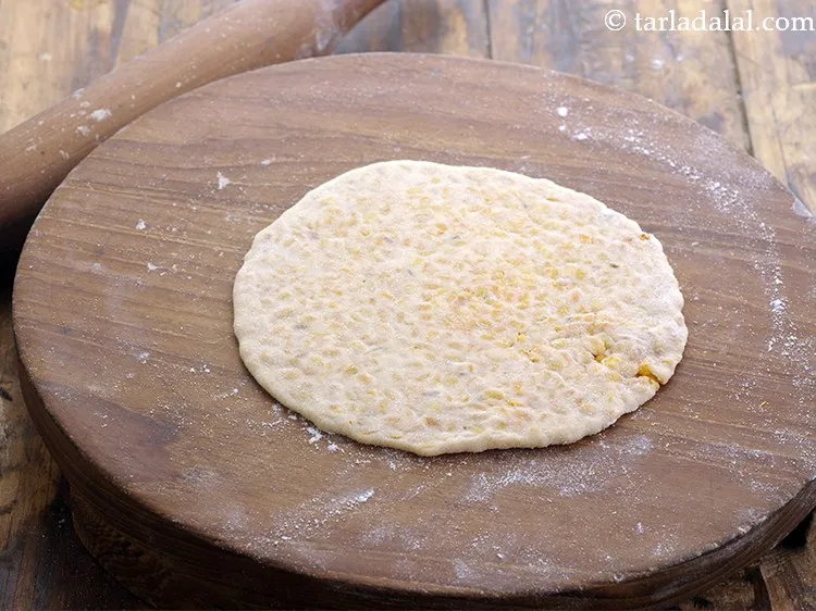Step 24 – Roll the <strong>Dal Paratha</strong> again into 5&quot; diameter using little wheat flour to roll.Be gentle …