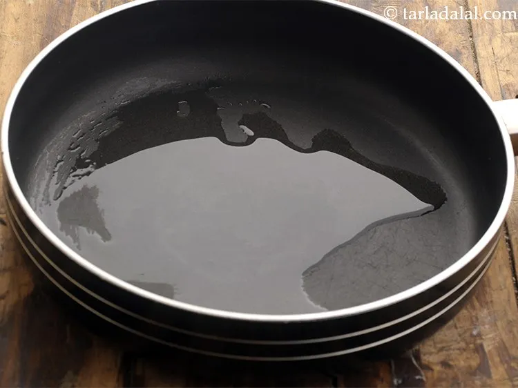 Step 10 – Heat oil in abroad non stick pan.