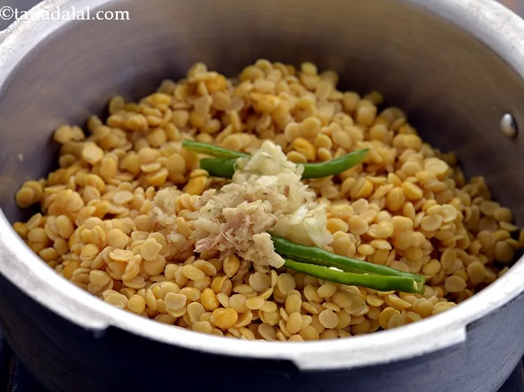 Step 16 – Add the garlic and ginger. If you are Jain, skip adding the lehsun.