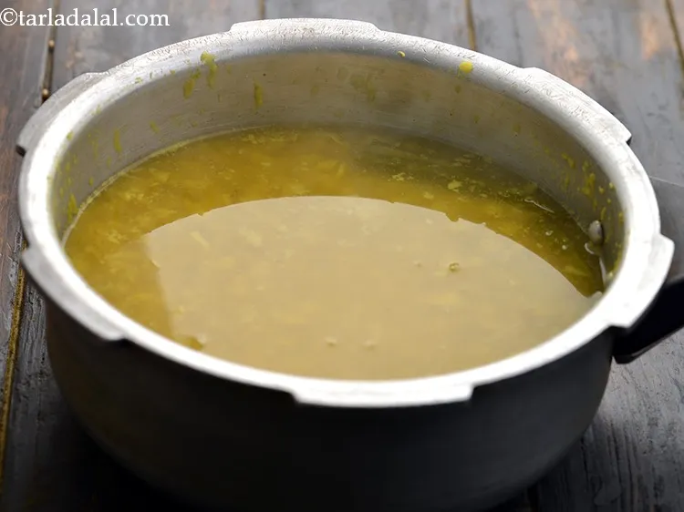 Step 19 – Pressure cook for 3 whistles or till the dals are cooked.&nbsp;Allow the steam to escape …