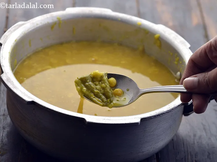 Step 20 – Mix and remove the green chilies and discard them.