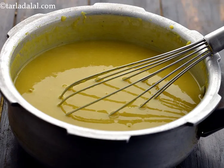 Step 21 – Whisk the dal so as to mash the dals. Keep aside.