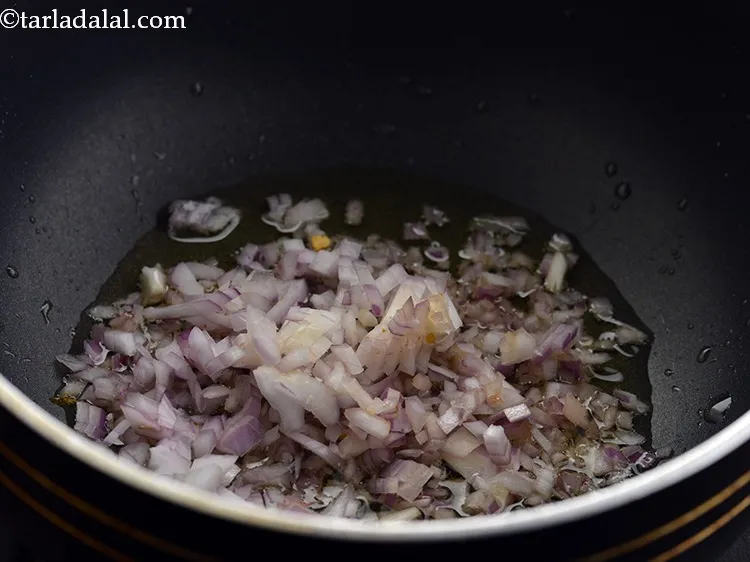Step 23 – When the oil is hot, add the onions.