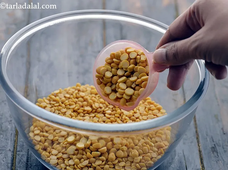 Step 8 – Add 1/4 cup chana dal to the same bowl.&nbsp;