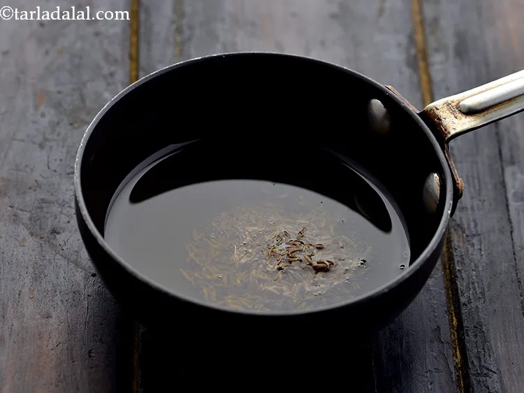 Step 30 – Add the mustard seeds and cumin seeds.