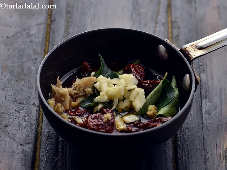 Step 33 – Add the ginger and garlic. It provides a nice mouthfeel to the Punjabi dal tadka.