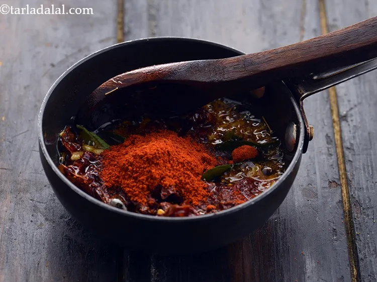 Step 35 – Switch off the flame, add chilli powder and mix well.