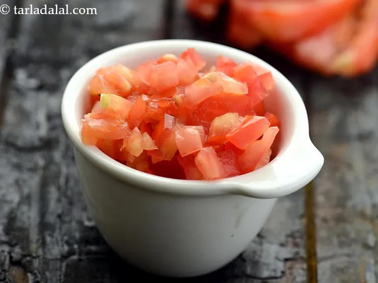 Step 11 – Place the tomatoes on a chopping board and chop them into medium sized pieces.