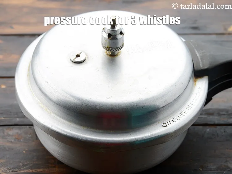 Step 7 – Pressure cooker for 3 whistles. Allow the steam to escape before opening the lid.&nbsp;