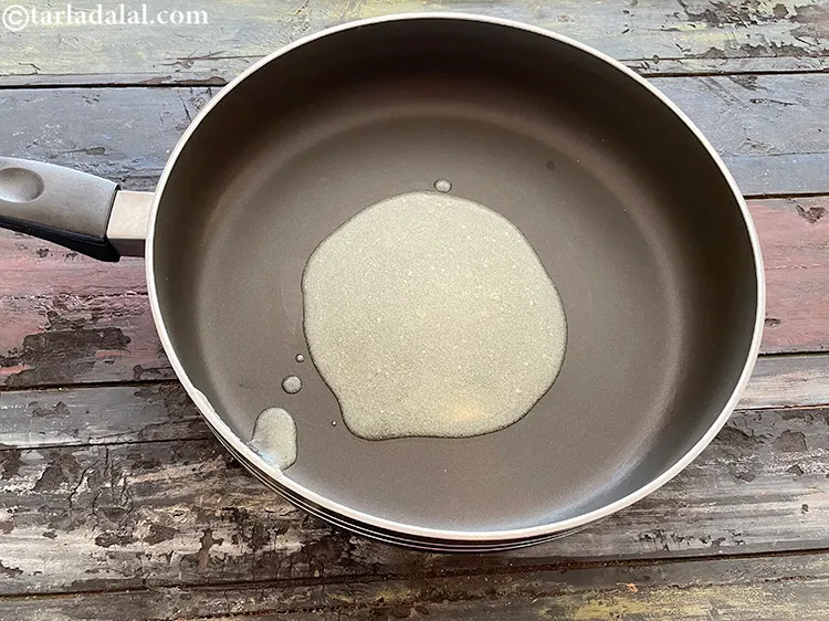 Step 3 – Heat the ghee in a broad non-stick pan.
