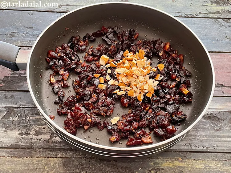 Step 6 – Switch off the flame and&nbsp;add the almonds. Use finely chopped almonds for the perfect mouthfeel. …