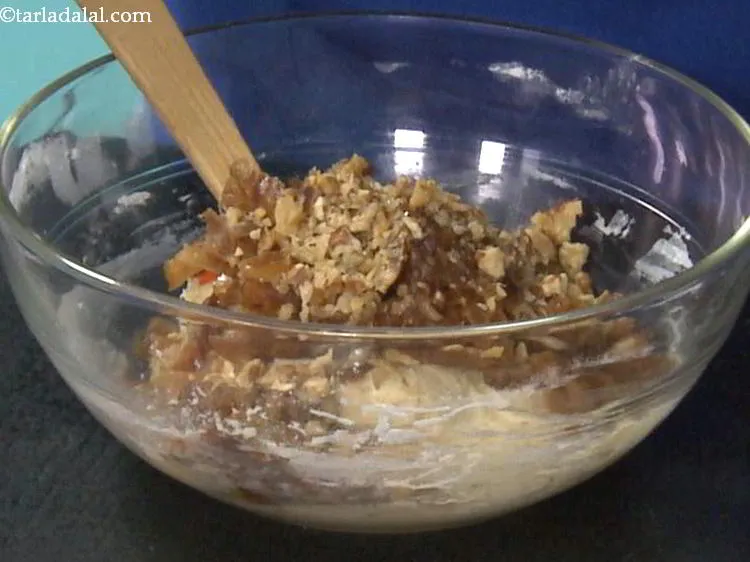 Step 20 – Add &frac12; cup walnuts. They provide a nice bite to the walnut dates cake.