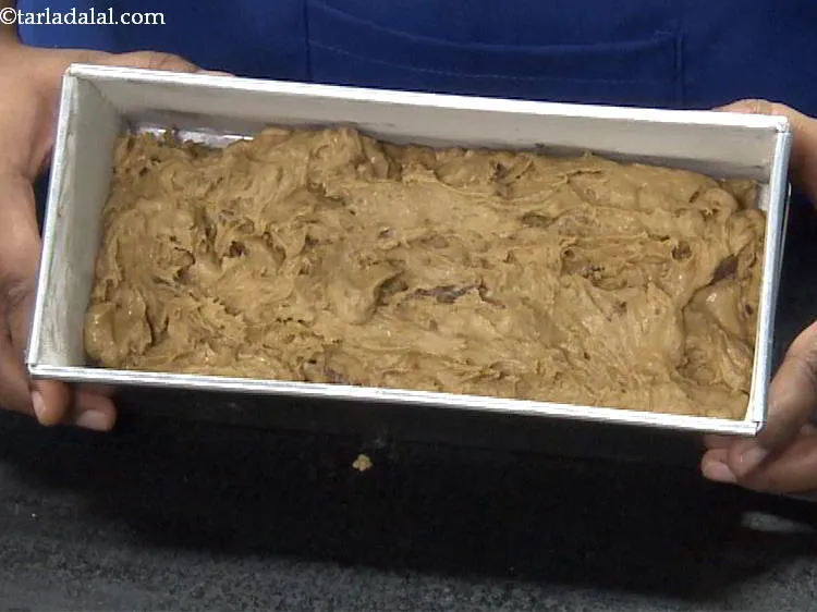 Step 23 – Pour the batter into the greased bread loaf tin and tap it lightly.