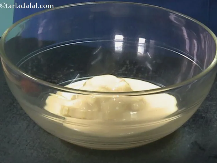 Step 14 – Pour the condense milk. Since, this is an eggless cake recipe we are using condense …