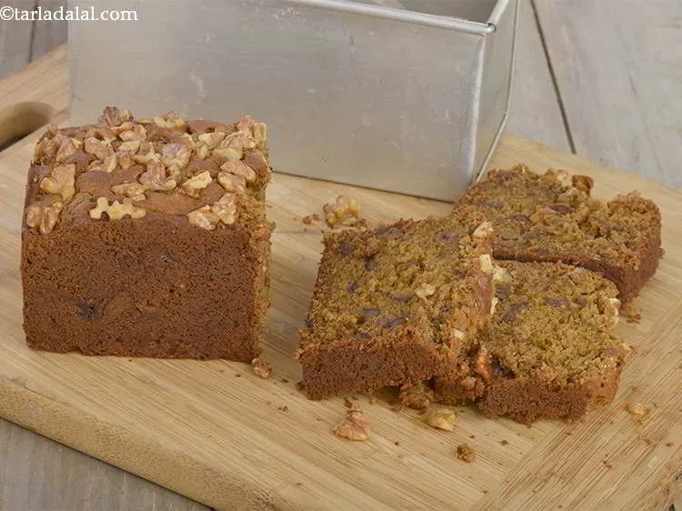 Step 30 – Serve the&nbsp;<strong>date walnut cake (eggless date walnut cake)</strong>&nbsp;or store in an air-tight container.