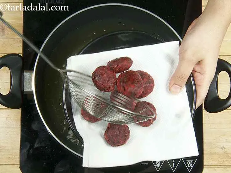 Step 16 – Drain on an absorbent paper. You can also shallow fry the tikkis instead of deep-frying.