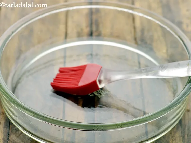 Step 17 – To make&nbsp;<strong>microwave doodhi muthia | &nbsp;quick lauki muthia |&nbsp;doodhi na muthia |&nbsp;</strong>Apply oil on your …