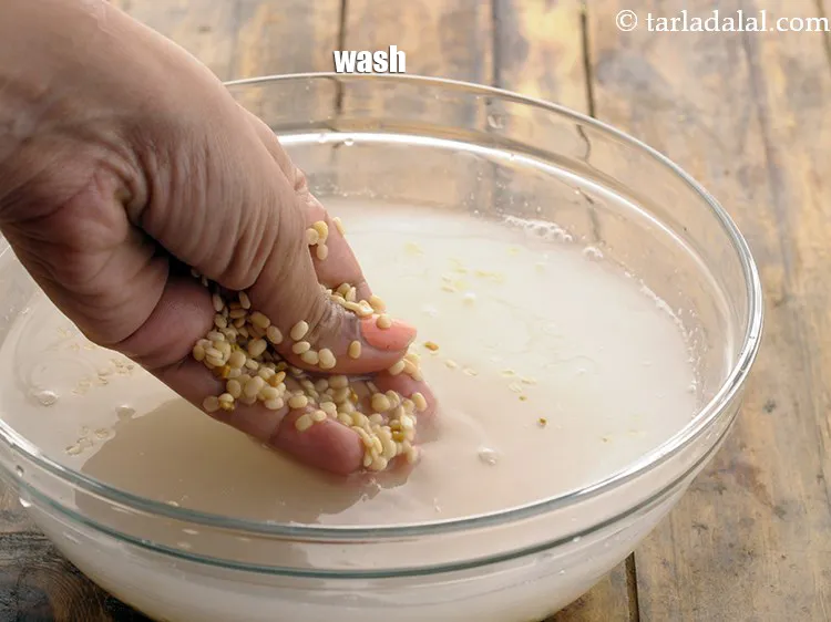 Step 6 – Wash the urad dal well with water to get rid of impurities if any.&nbsp;Drain it.