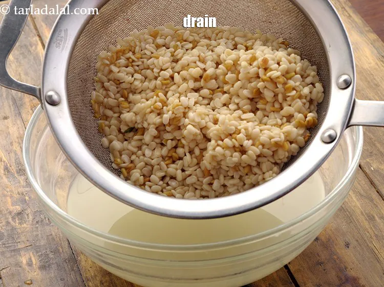 Step 15 – <meta charset="UTF-8" />Drain the urad dal and fenugreek seeds using a stainer. They must have …