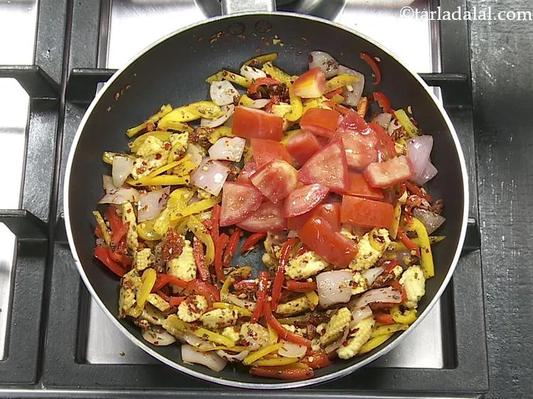 Step 10 – Add the tomatoes.