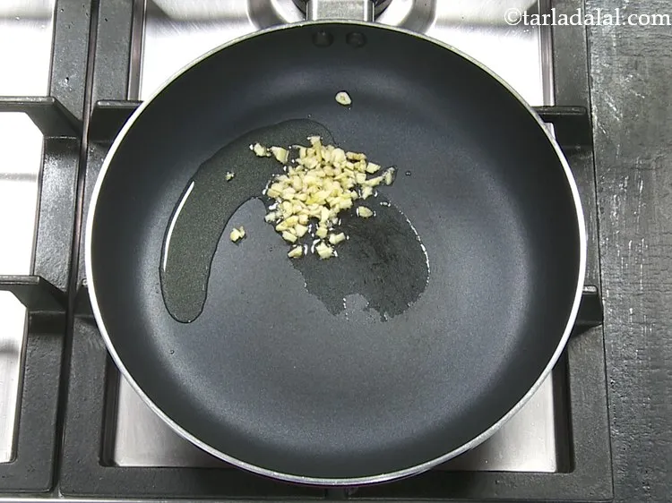 Step 2 – Once the oil is hot, add garlic.